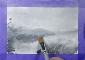 Petite brosse plate souple utilisée pour affiner un paysage peint à la gouache